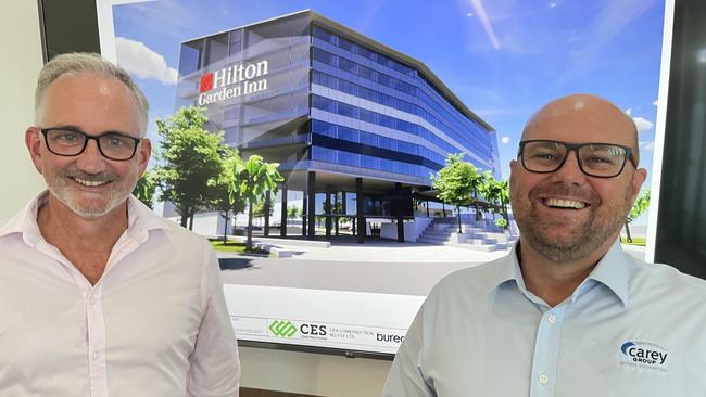 Focus Pacific chief executive Michael Graham and Carey Group chief executive Matt Thomson have revealed a new look for the rebranded Hilton Garden Inn project. Picture: Leighton Smith