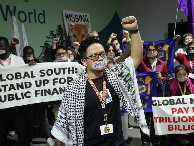 BAKU, AZERBAIJAN - NOVEMBER 22: Activists demanding that rich countries pay up for climate finance for developing countries of the Global South protest on day eleven at the UNFCCC COP29 Climate Conference on November 22, 2024 in Baku, Azerbaijan. While today is scheduled to be the last day of the COP29, party delegates from numerous countries have voiced strong disappointment over the preliminary text of the final agreement, which will very likely send the conference into overtime. The COP29 is bringing together stakeholders, including international heads of state and other leaders, country delegations, scientists, environmentalists, indigenous peoples representatives, activists and others to discuss and agree on the implementation of global measures towards mitigating the effects of climate change. According to the United Nations, countries made no progress over the last year in reducing global emissions from the burning of fossil fuels. (Photo by Sean Gallup/Getty Images)