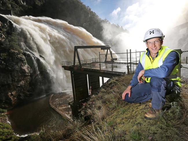 Hydro Tasmania Dam Safety Manager Chris Topham at the flowing spillway (150 cubic metres per second) of the Cethana Dam