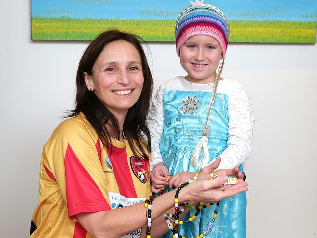 Stephanie Atkinson and daughter Ruby show Ruby’s “Beads of Courage” necklace which show her milestones in hospital for her treatment for acute lymphoblastic leukaemia. Picture: Adam Ward