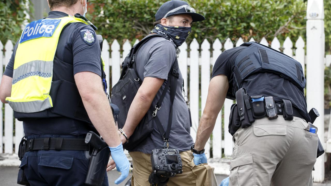 Herald Sun photographer Jake Nowakowski is handcuffed by police at an anti-vax protest on Saturday. Picture: NCA NewsWire/David Geraghty