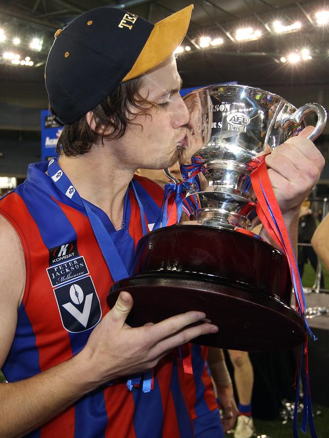 Billy Burstin kisses the premiership cup after the grand final win.