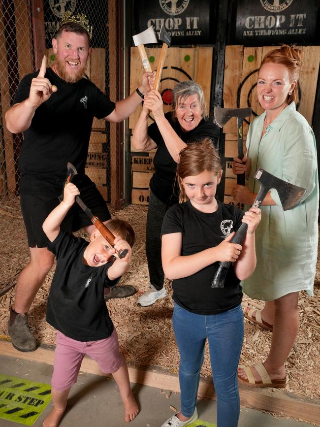 Baz and Jayne Dewson, and their children, Grace, 7, and Sol, 3, with Baz’s mum Aileen together run CHOP IT Axe Throwing &amp; Escape IT Rooms at Victor Harbor. 28 December 2024. Picture: Dean Martin