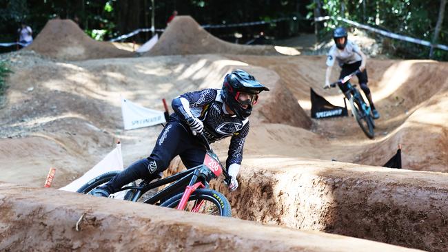 Chase Minos and Jackson McPherson go head to head in the U19 Men's Dual Slalom quarter finals at the first day of the Cairns round of the Crankworx World Tour, held at the Smithfield Mountain Bike Park. Picture: Brendan Radke