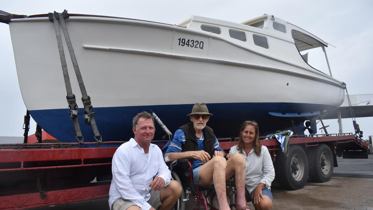 (L) Richard Grace, Bill Olds and Emma Grace with the restored boat, on its way down to Brisbane. Photo: Stuart Fast