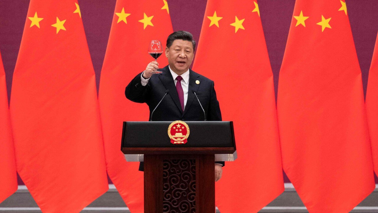 (FILES) In this file photo China's President Xi Jinping raises his glass and proposes a toast at the end of his speech during the welcome banquet for leaders attending the Belt and Road Forum at the Great Hall of the People in Beijing on April 26, 2019. - The global infrastructure plan announced by G7 leaders aims to offer developing nations a credible alternative to China's much-criticized Belt and Road Initiative -- but it faces major hurdles on the ground, especially if Beijing's hiccups are any indication.  US President Joe Biden was able to convince the G7 to sign onto the initiative, drawing allies into Washington's strategic rivalry with Beijing, under a plan titled "Build Back Better World" (B3W) that aims to provide hundreds of billions in infrastructure investment to developing nations. (Photo by Nicolas ASFOURI and NICOLAS ASFOURI / POOL / AFP)