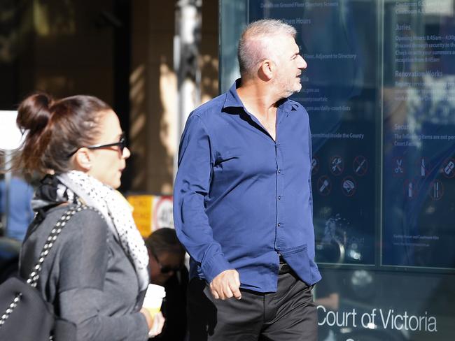 Bill Vlahos arrives at the County Court of Victoria.