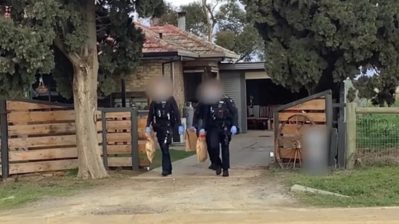 Specialist police at a drug lab bust in Lara.