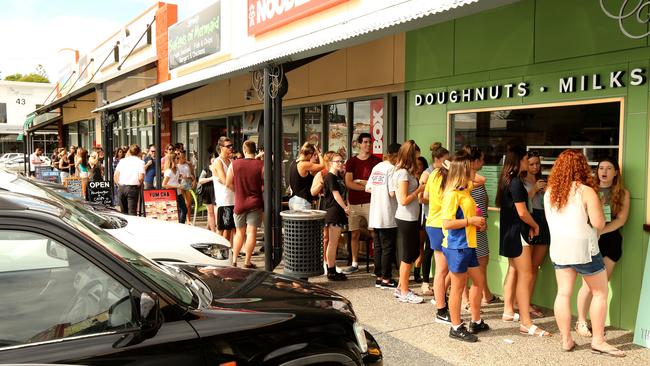 People queuing for the free doughnuts at the new doughnut shop 'dougnhnuttime' at Mermaid Beach . 18 year old Dana Steele .Picture Mike Batterham