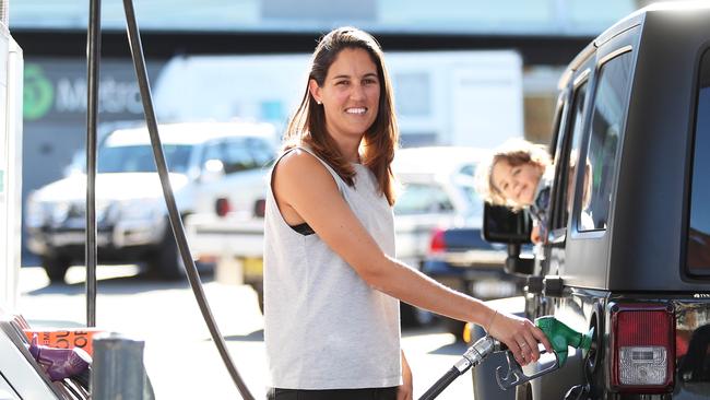 Jess Walker and son Lachlan are always on the lookout for cheap fuel. Picture: Brett Costello