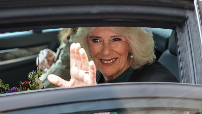 Public duties: Queen Camilla smiles and waves as she departs a World Poetry Day event in Belfast last week. Picture: Getty Images