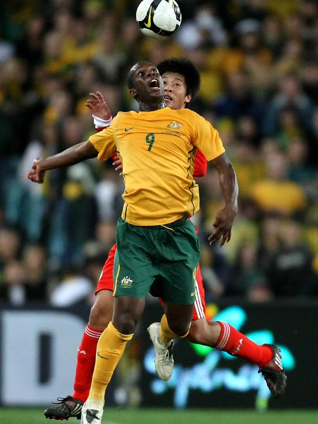 Bruce Djite heads the ball during the Football World Cup qualifier match for the Socceroos against China in Sydney in 2008.