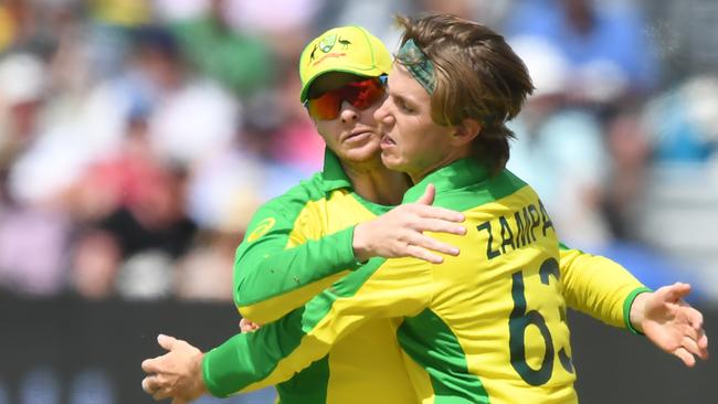 Australia's Steve Smith (L) and Australia's Adam Zampa celebrate the wicket of Afghanistan's Rahmat Shah for 43 during the 2019 Cricket World Cup group stage match between Afghanistan and Australia at Bristol County Ground in Bristol, southwest England, on June 1, 2019. (Photo by Dibyangshu SARKAR / AFP) / RESTRICTED TO EDITORIAL USE