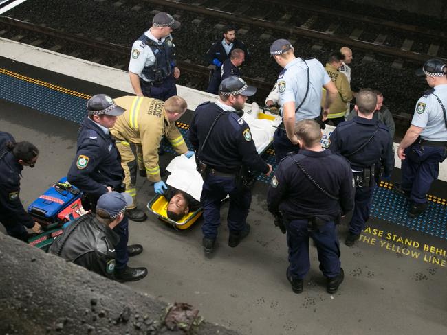 The man is placed on a stretcher after being pulled to safety.  Picture: Damian Hofman