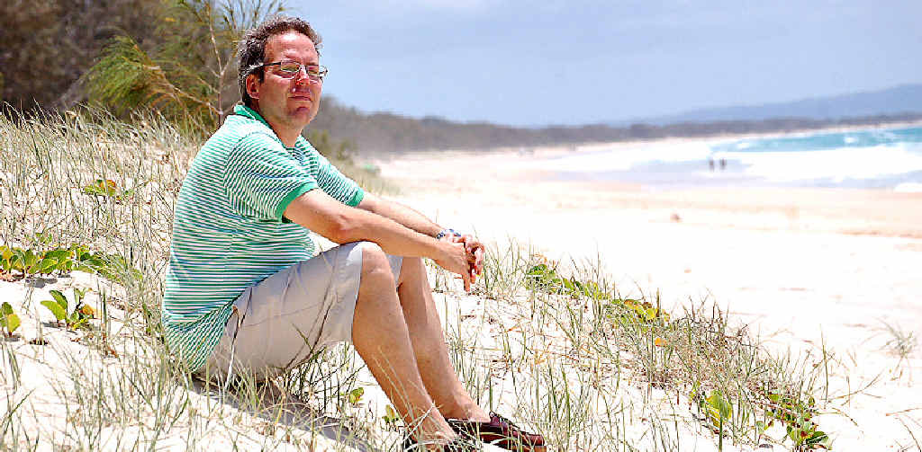 NO HAPPY ENDING: Andreas Krauchi on the beach in front of his Rainbow Shores development. Picture: Craig Warhurst C