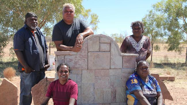 Vincent Lingiari’s grandchildren at his grave site. Picture: Penny Smith