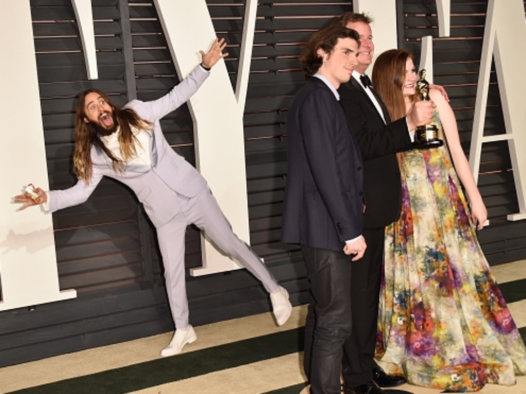 Jared Leto photobombs producer James W. Skotchdopole and guests at the 2015 Vanity Fair Oscar Party on February 22, 2015 in Beverly Hills. Picture: Getty