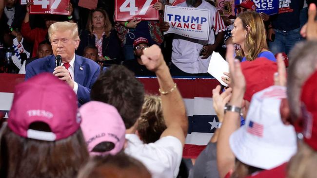 Mr Trump and Ms Sanders at the event in question. Picture: Jeff Kowalsky/AFP