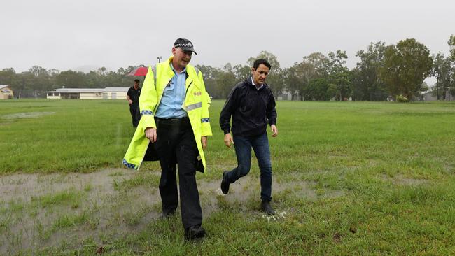 A monsoonal tropical low pressure system has brought devastating widespread flooding to North Queensland and parts of Far North Queensland, with ove 1000 millimetres of rain recorded in Cardwell. Queensland Premier David Crisafulli is briefed by Cassowary Coast Police Inspector Nathan Blaine after he arrives in Cardwell, which was inundated with flood water on Sunday night. Picture: Brendan Radke