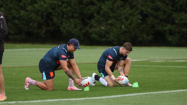 (L-R) Latrell Mitchell and Zac Lomax line up shots at goal during training on Thursday. Picture: Rohan Kelly