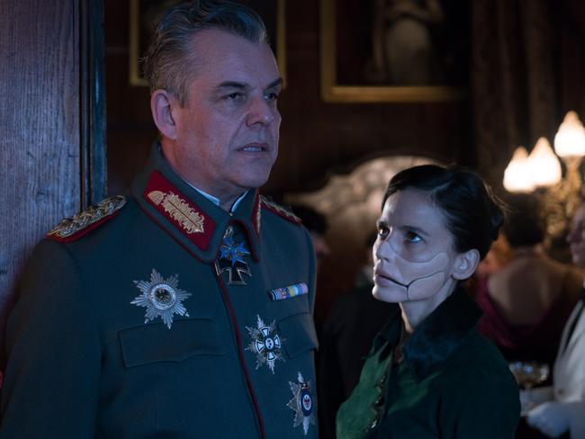 Danny Huston’s General Erich Ludendorff and Elena Anaya’s Doctor Poison are a couple of villainous Germans. Picture: Clay Enos / Warner Bros Pictures