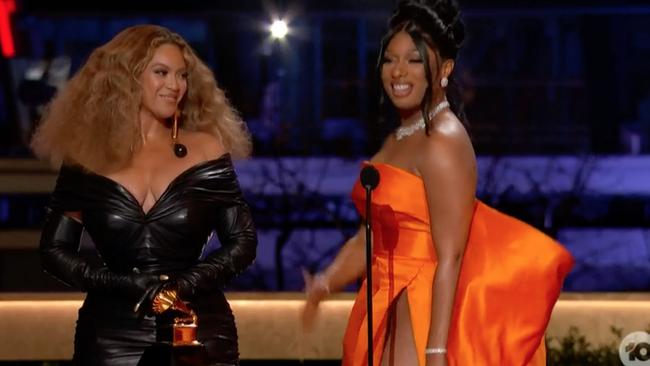 Beyonce and Megan The Stallion accept their award.