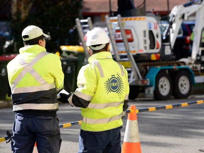 Contractors install cable as part of the rollout of the NBN across Australia.