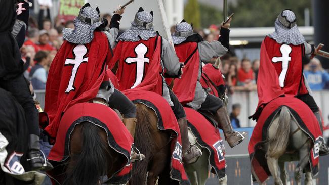 In this Feb. 23, 2019, photo, the Crusader horseman ride around the arena prior to the start of the Super Rugby match between the Crusaders and Hurricanes in Christchurch, New Zealand. The Crusaders announced Wednesday, April 3, 2019, that they will be considering a change to their name and branding following the Christchurch terrorist attacks on March 15 - insisting the status quo is "no longer tenable." (AP Photo/Mark Baker)