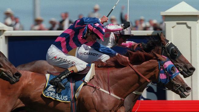 Horseracing - racehorse Might and Power (back) ridden by Jim Cassidy winning 1997 Melbourne Cup race from Doriemus (front) ridden by Greg Hall. a/ct might/and/power photo finish /Horseracing/Melbourne/Cup