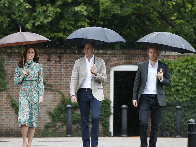 Catherine, Duchess of Cambridge, Prince William, Duke of Cambridge and Prince Harry are seen during a visit to The Sunken Garden at Kensington Palace on August 30, 2017 in London Picture: Getty.