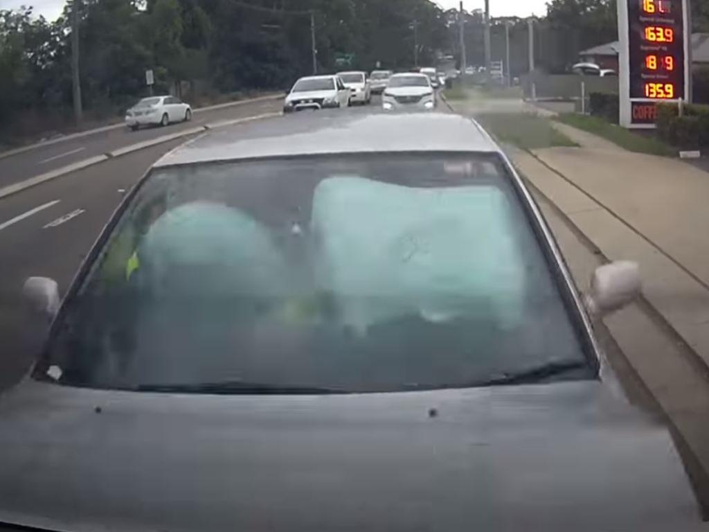 A distracted driver was filmed smashing into a car containing two young children. Picture: dashcam Owners Australia