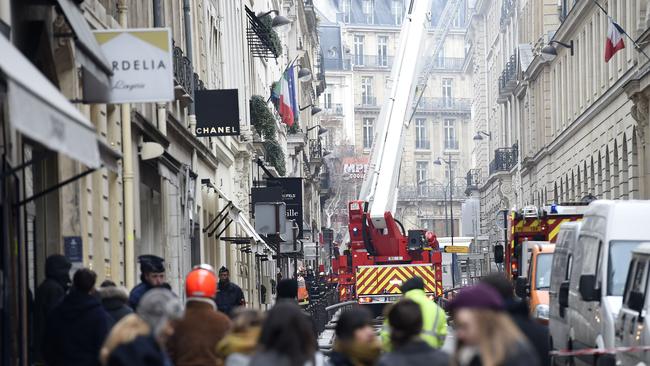 Firefighters work on extinguishing a fire .. at the Ritz Hotel in Paris. Picture: AFP