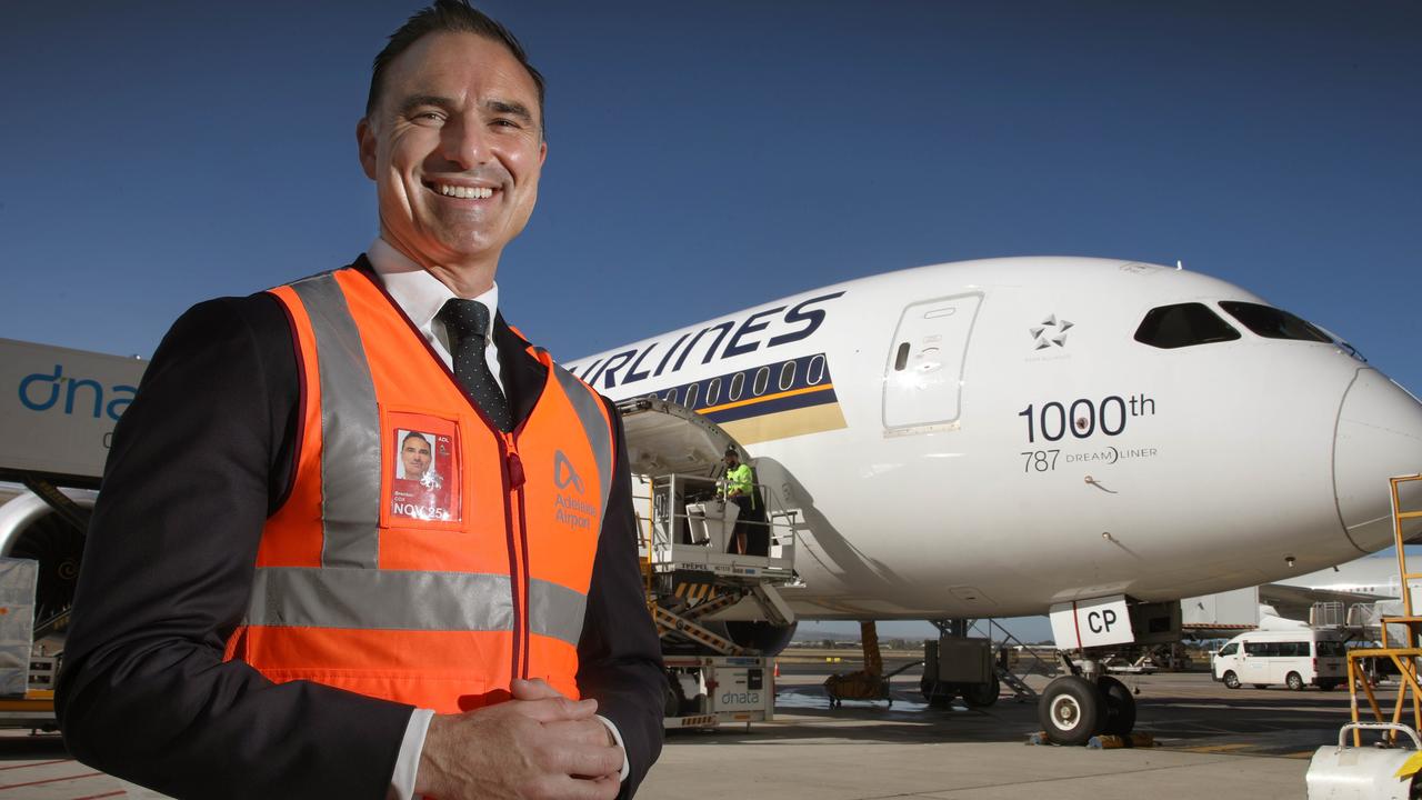 Brenton Cox outside a Singapore Airlines aircraft. Picture: Dean Martin