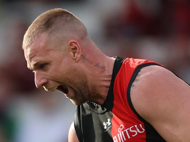 MELBOURNE, AUSTRALIA - AUGUST 04: Jake Stringer of the Bombers celebrates kicking a goal during the round 21 AFL match between Essendon Bombers and Fremantle Dockers at Melbourne Cricket Ground, on August 04, 2024, in Melbourne, Australia. (Photo by Daniel Pockett/Getty Images)