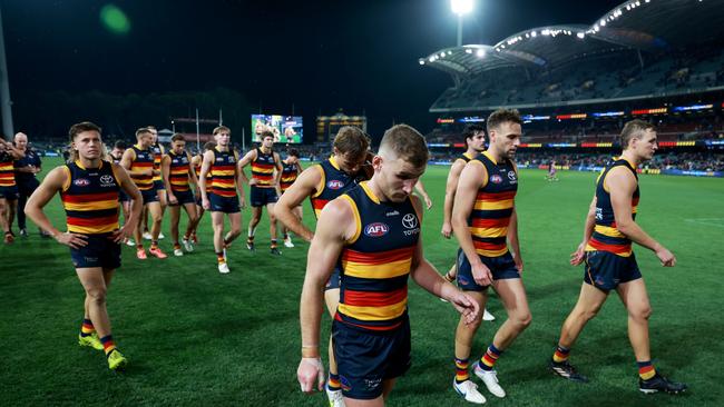 Crows players trudge off after the loss to Collingwood. Picture: James Elsby/AFL Photos via Getty Images