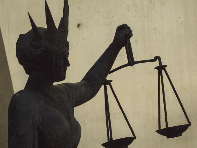 BRISBANE , AUSTRALIA - NewsWire Photos - BRISBANE , JUNE 24 2024: Generic photo of the scales of justice stature outside Brisbane Supreme Court in the Brisbane CBD. Picture: NewsWire / Glenn Campbell