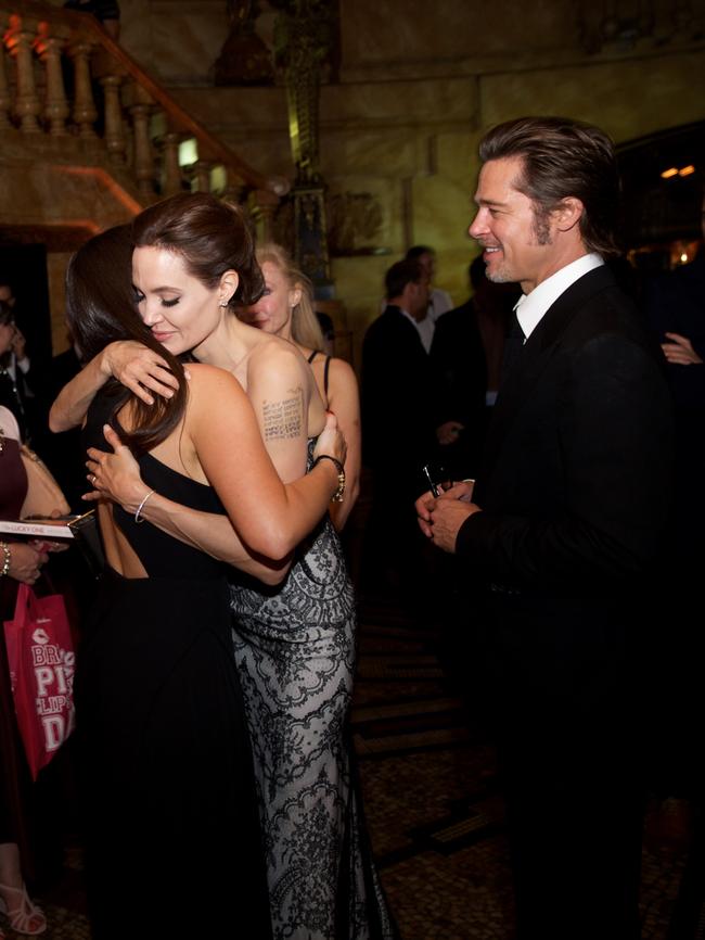 Angelina Jolie embraces Krystal Barter as Brad Pitt looks on. Picture: Universal Pictures Australia