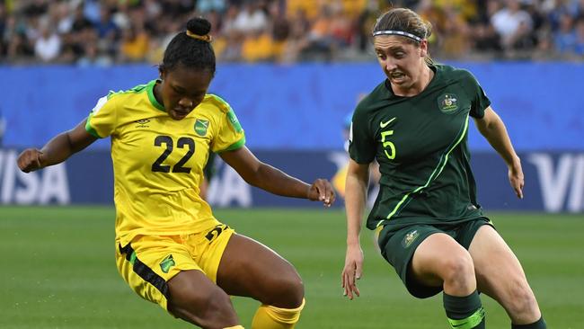 Matildas defender Karly Roestabakken (right) challenges Jamaican forward Kayla McCoy. Picture: AFP