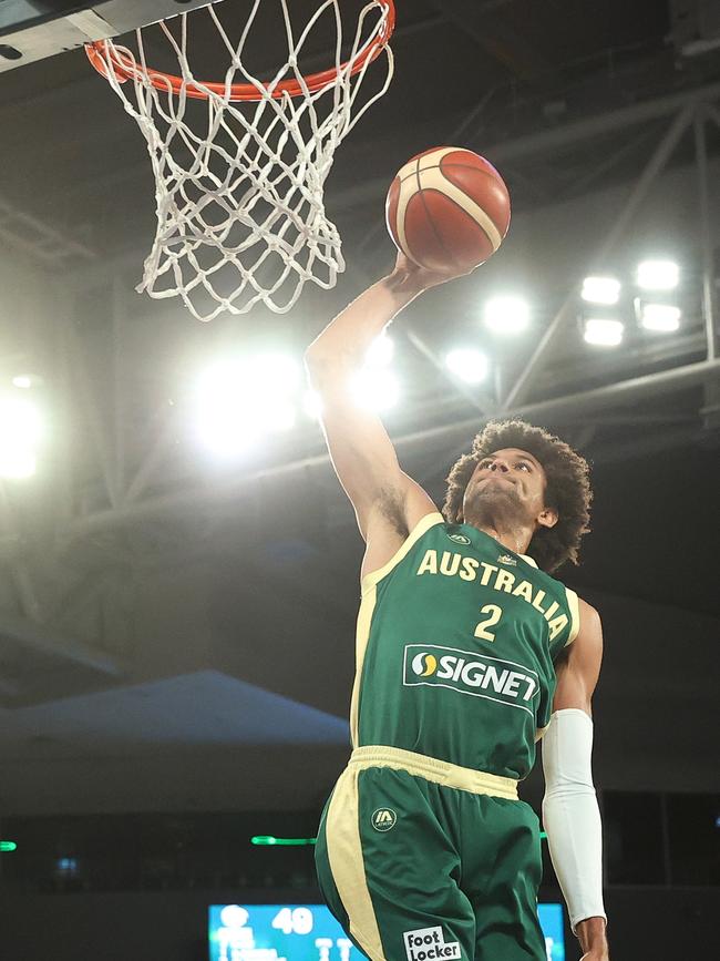 Matisse Thybulle goes up for the Boomers. Picture: Kelly Defina/Getty Images