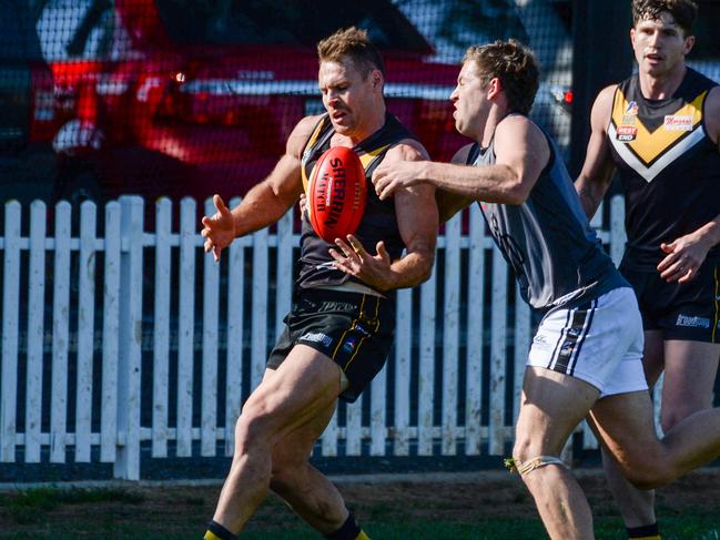 AUGUST 21, 2021: PortÃs Luke McInerney tackles BrightonÃs Nigel Osborn during Adelaide Footy League division one match between Brighton Bombers and Port District at Brighton Oval. Picture: Brenton Edwards