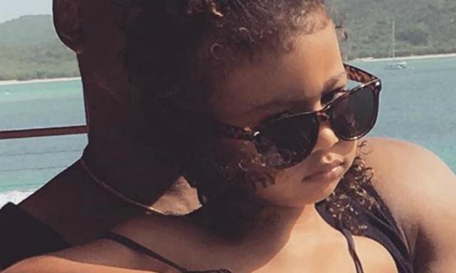 North West is "struggling" with being a big sister