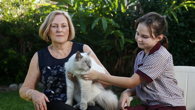 Forest Gardens resident Lesley Laska, pictured with her granddaughter Lara Laska, 11, received a $266 fine from Cairns Regional Council for failing to secure her pet, after a neighbour made a complaint about her ragdoll cat Monty roaming into their backyard. PICTURE: BRENDAN RADKE