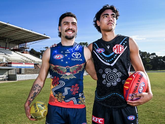 ADELAIDE, AUSTRALIA – MAY 13: Izak Rankine of the Crows and Jase Burgoyne of the Power pose in their Indigenous guernseys during the 2024 Sir Doug Nicholls Round Launch at Central Districts Football Club on May 13, 2024 in Adelaide, Australia. (Photo by Mark Brake/AFL Photos/via Getty Images)