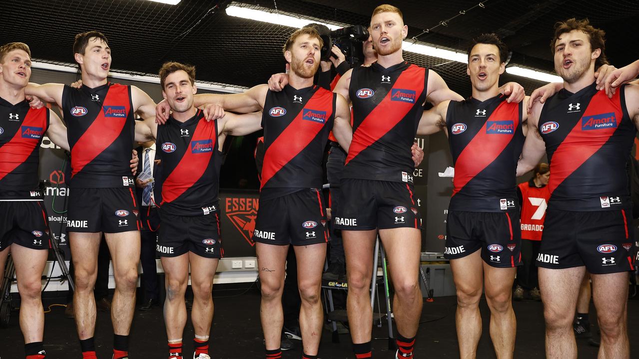 The Bombers sing the team song after the win over Adelaide. Picture: Daniel Pockett