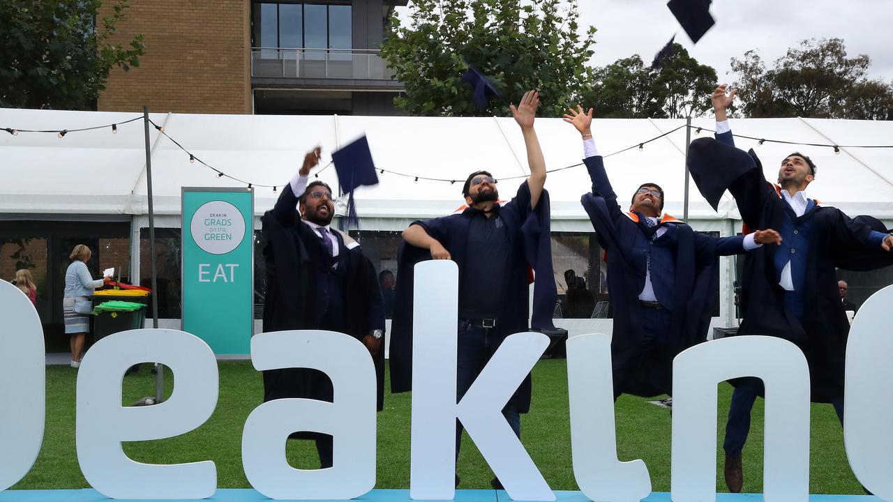 Deakin University graduates celebrate. Picture: Alison Wynd