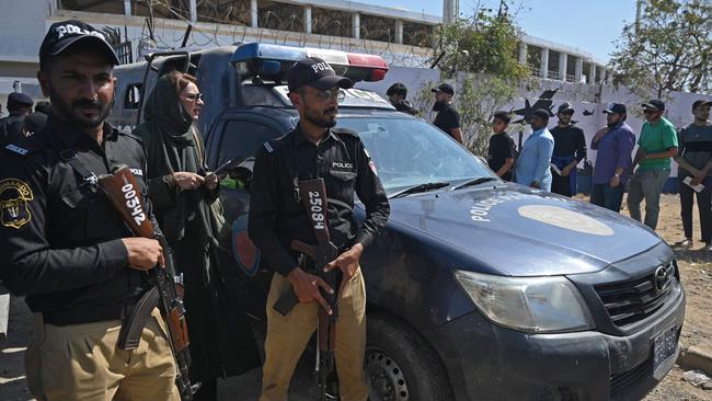 Security personnel stand guard outside the National Stadium in Karachi. Picture: Rizwan Tabassum / AFP