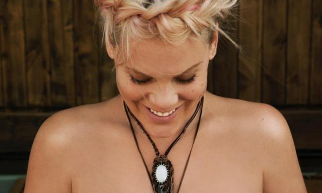 ‘The snuggle is real’: Pink shows off baby bump in topless pic
