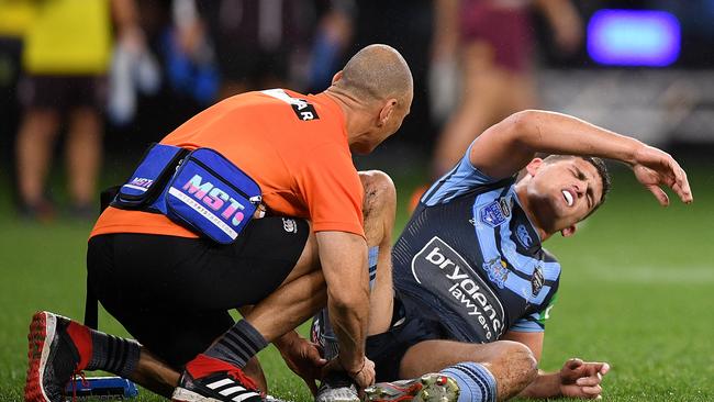 Nathan Cleary of the Blues receives attention from a trainer during Game 2 of the 2019 State of Origin series between the Queensland Maroons and the New South Wales Blues at Optus Stadium in Perth, Sunday, June 23, 2019. (AAP Image/Dan Himbrechts) NO ARCHIVING, EDITORIAL USE ONLY