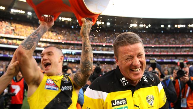 Dustin Martin tips Gatorade on Damien Hardwick after the game.