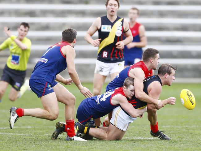 Lachlan Watt of Tigers gets the ball away in a TSL North Hobart Demons v Tigers at North Hobart Oval. Picture: MATT THOMPSON